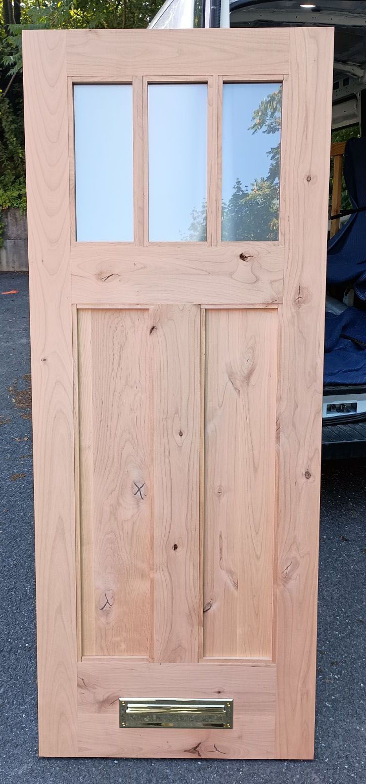 Dove #28500
Knotty Alder door slab
Acid etch glass
Mail slot installed
