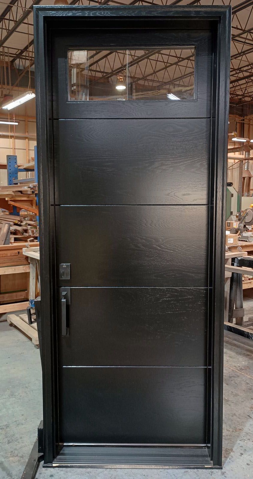 Johnson #28350
White oak horizontal grain flush door with v-grooves & clear ig
Painted black