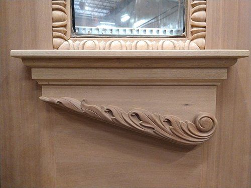 A wooden shelf with a mirror on top of it.