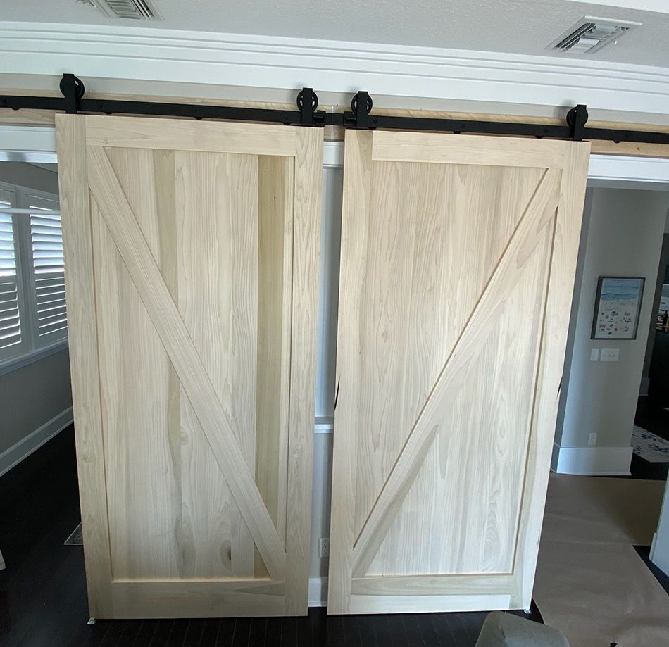 A pair of sliding barn doors in a living room