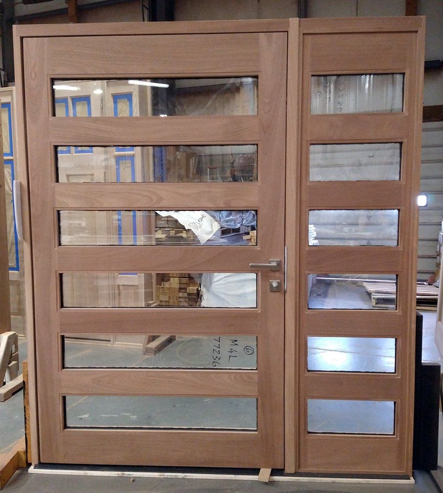 A wooden door with a lot of windows on it