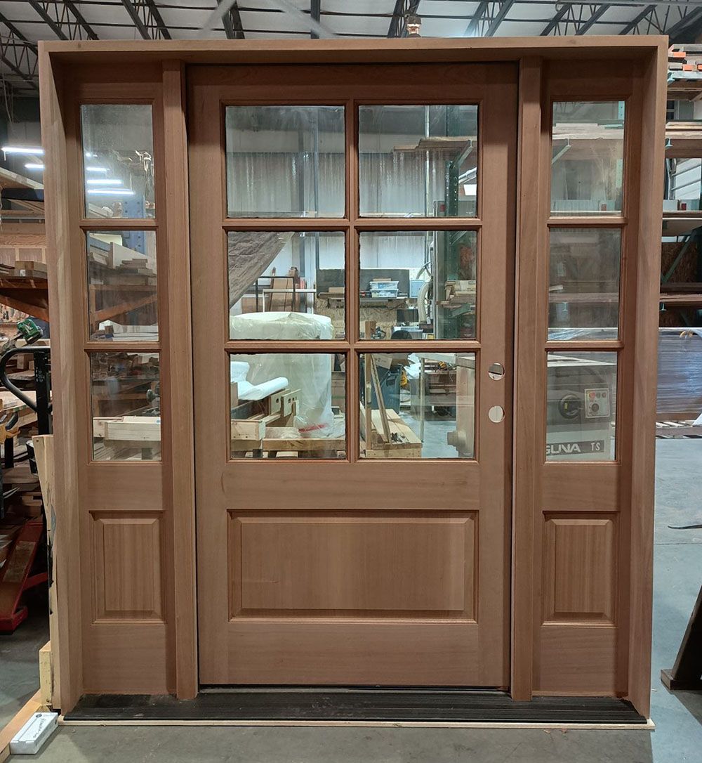A wooden door with glass panels is sitting in a warehouse. Alexandria & Sons #28428
Mahogany door - unfinished