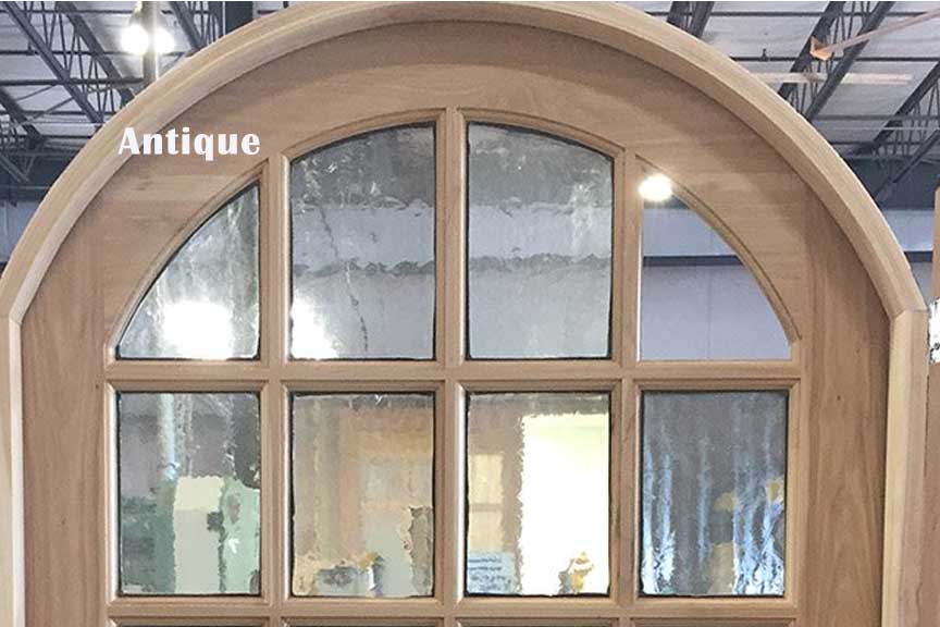 A wooden door with antique written on it