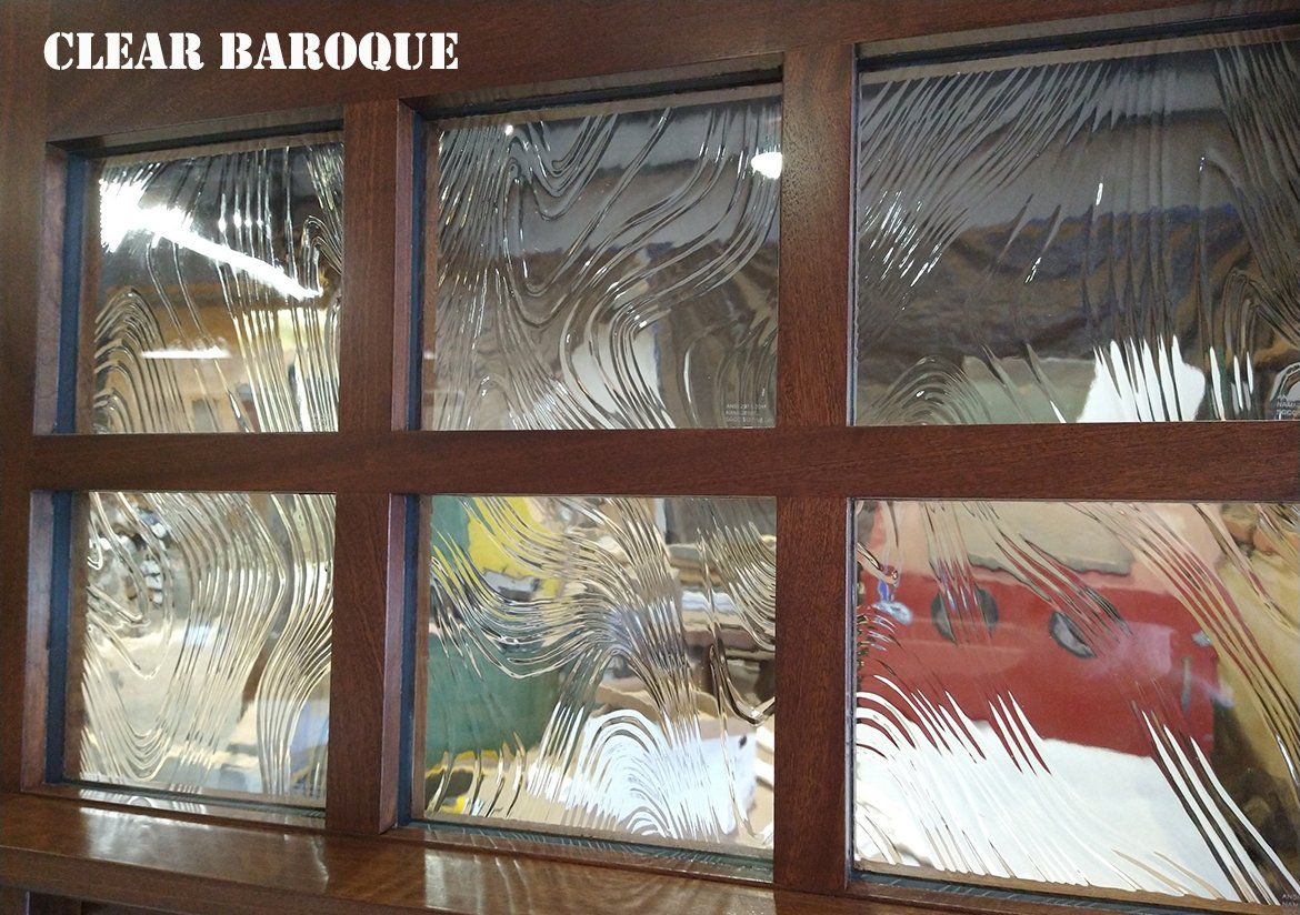 A clear baroque window with a wooden frame