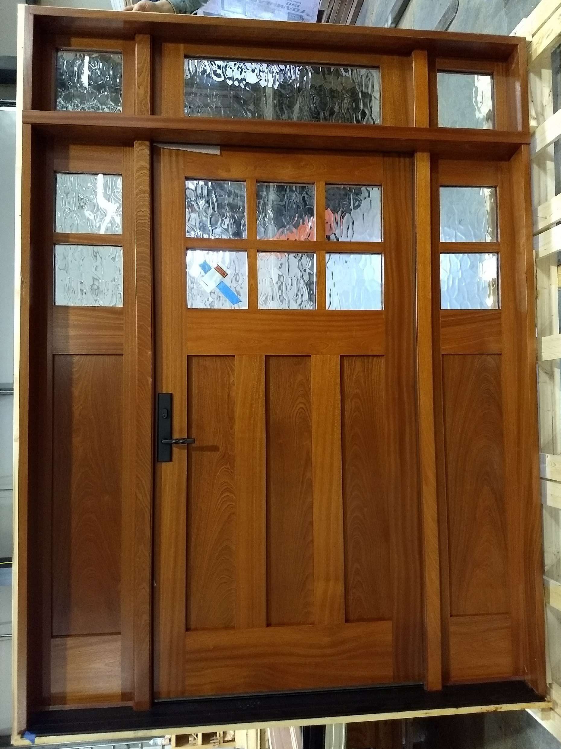 A wooden door with a sliding glass door