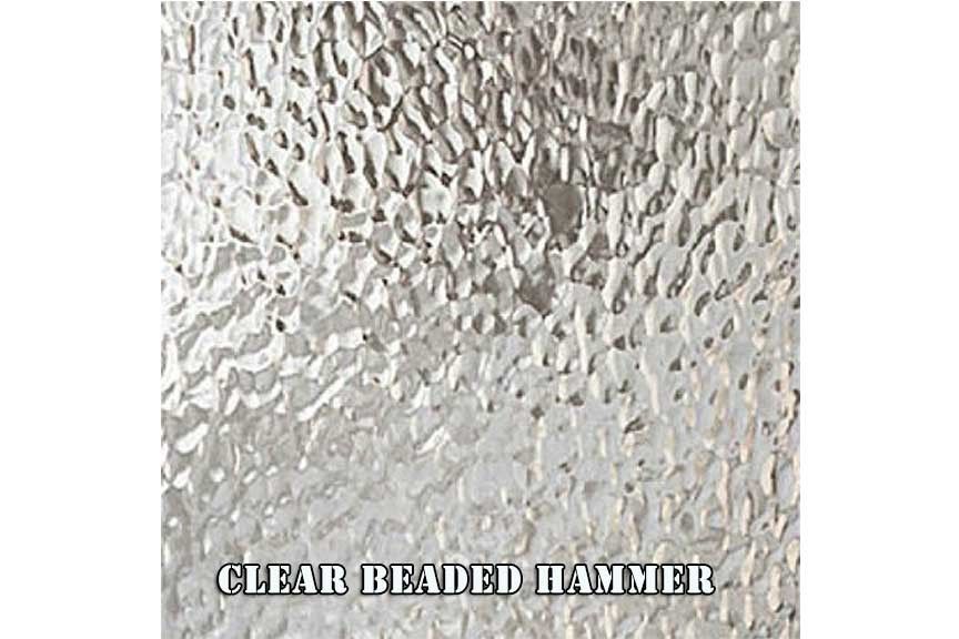 A close up of a clear beaded hammer glass