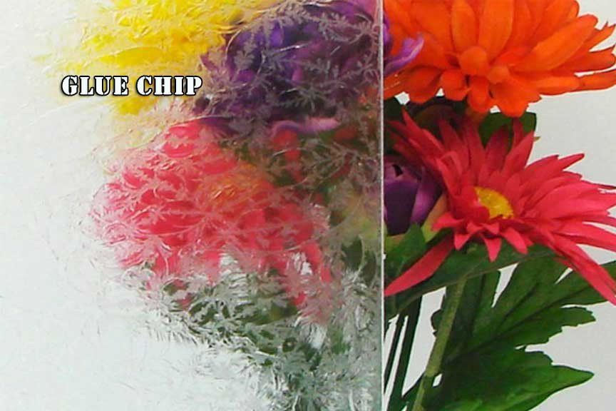 A bunch of flowers in a glass vase with the words glue chip above them