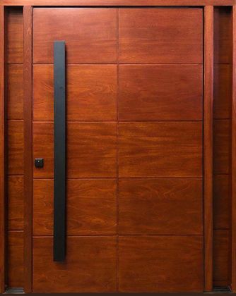A close up of a wooden door with a black handle.