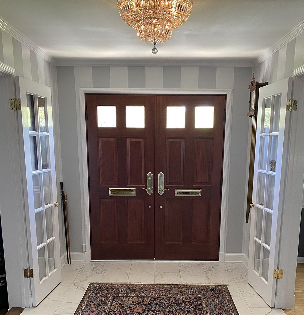 Solid mahogany wood double doors with brass hardware