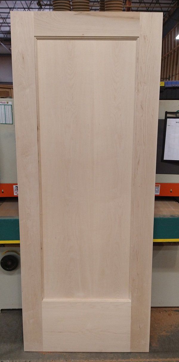 Single panel interior door made from solid maple wood