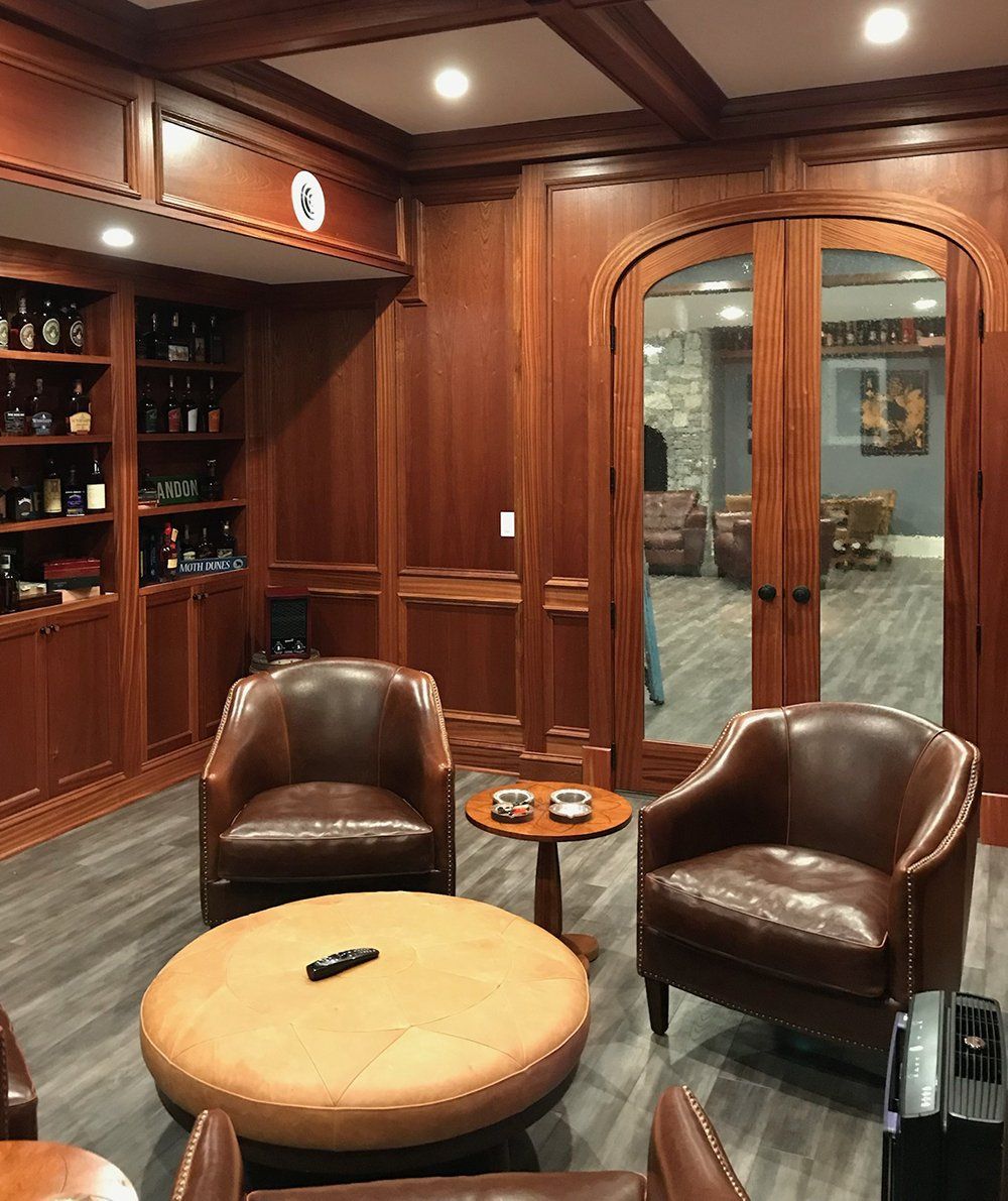 A living room with chairs and a round table