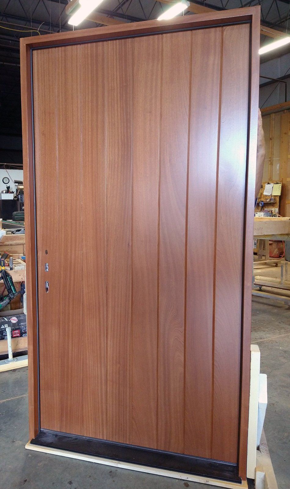 Mahogany flush door with v-grooves Finished in honey