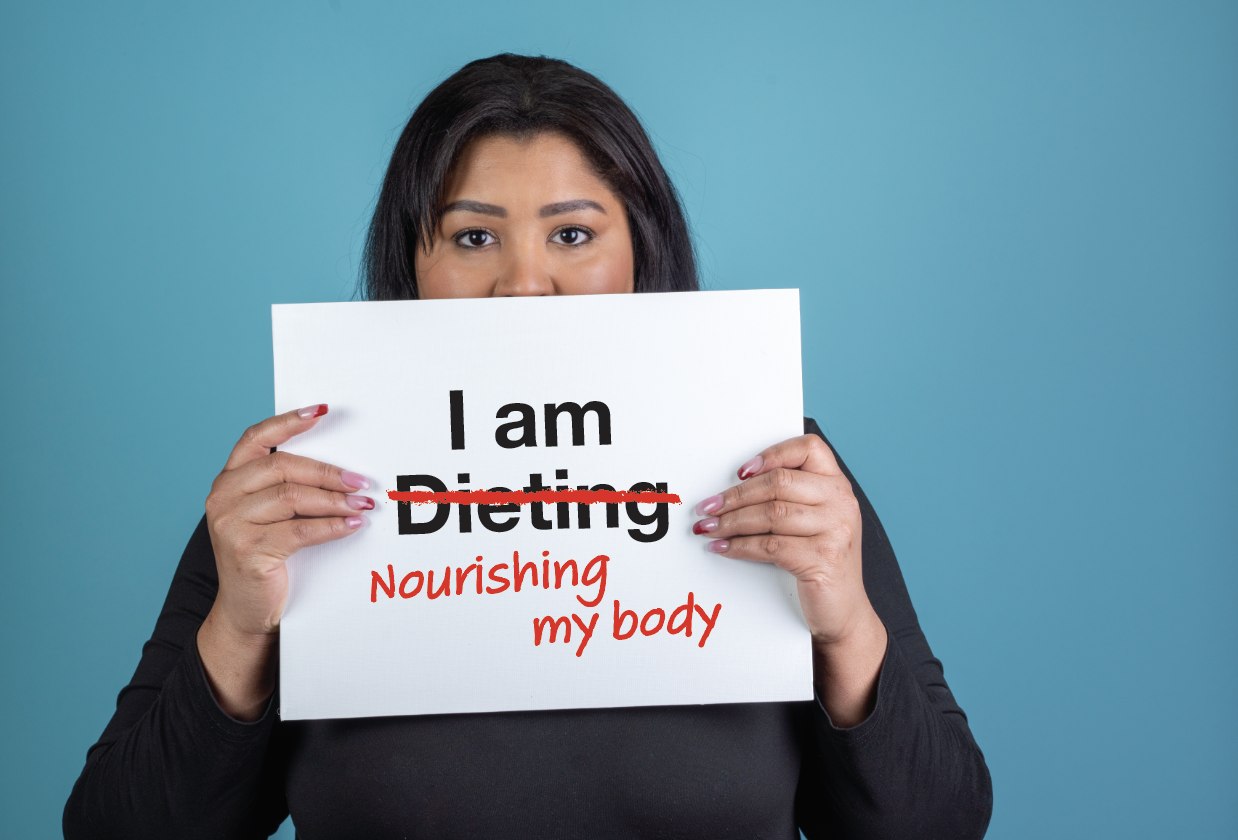 A woman holding a sign that says 