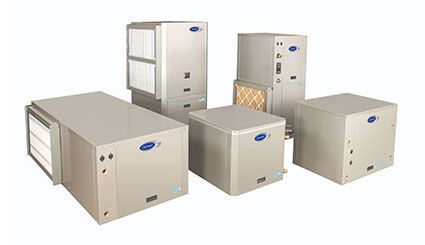 Four beige HVAC air conditioning units on a white background