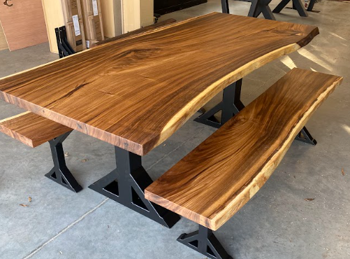 A stunning luxury custom dining table with live edge wood and epoxy resin.