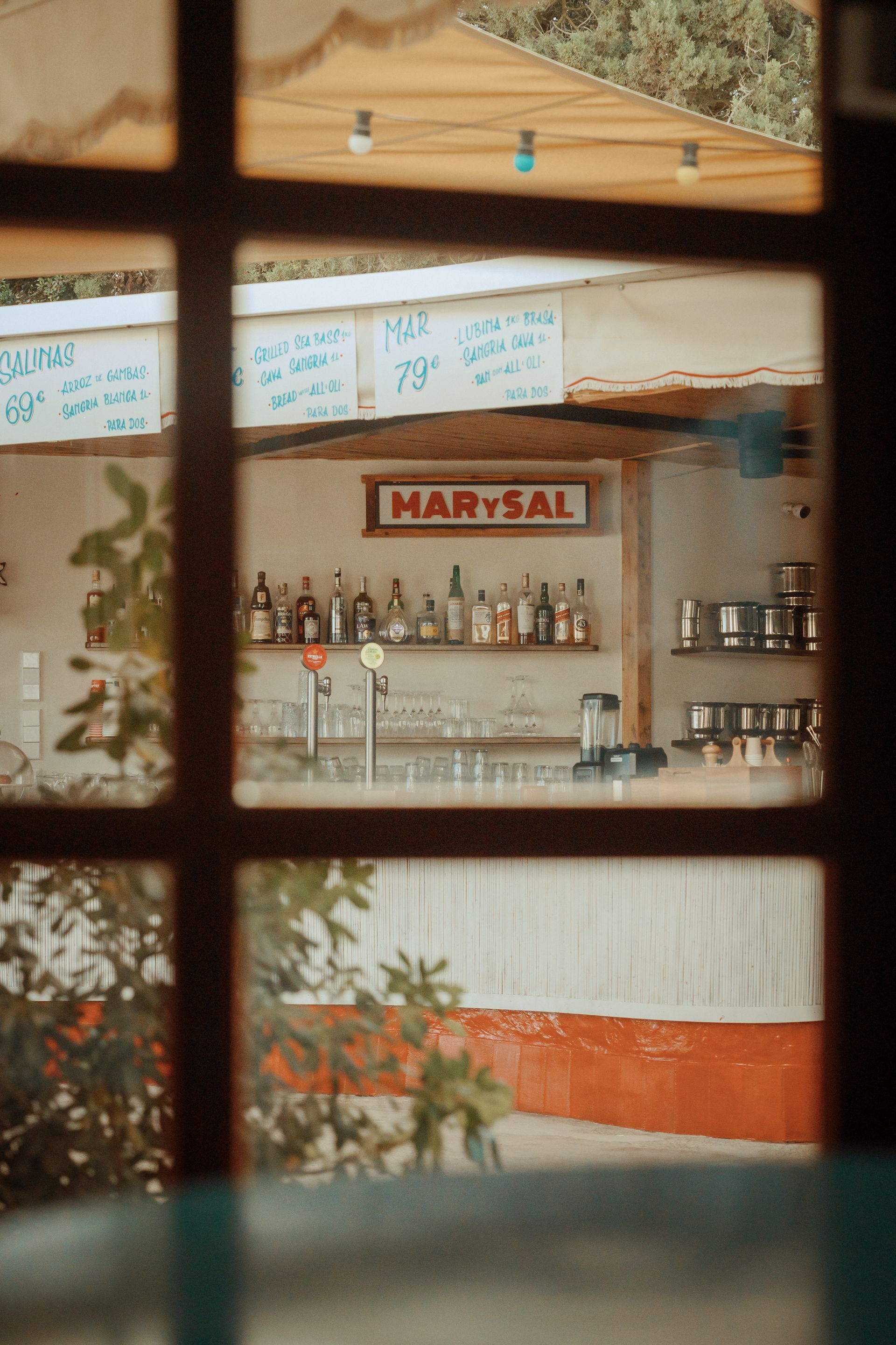A view of a bar through a window.