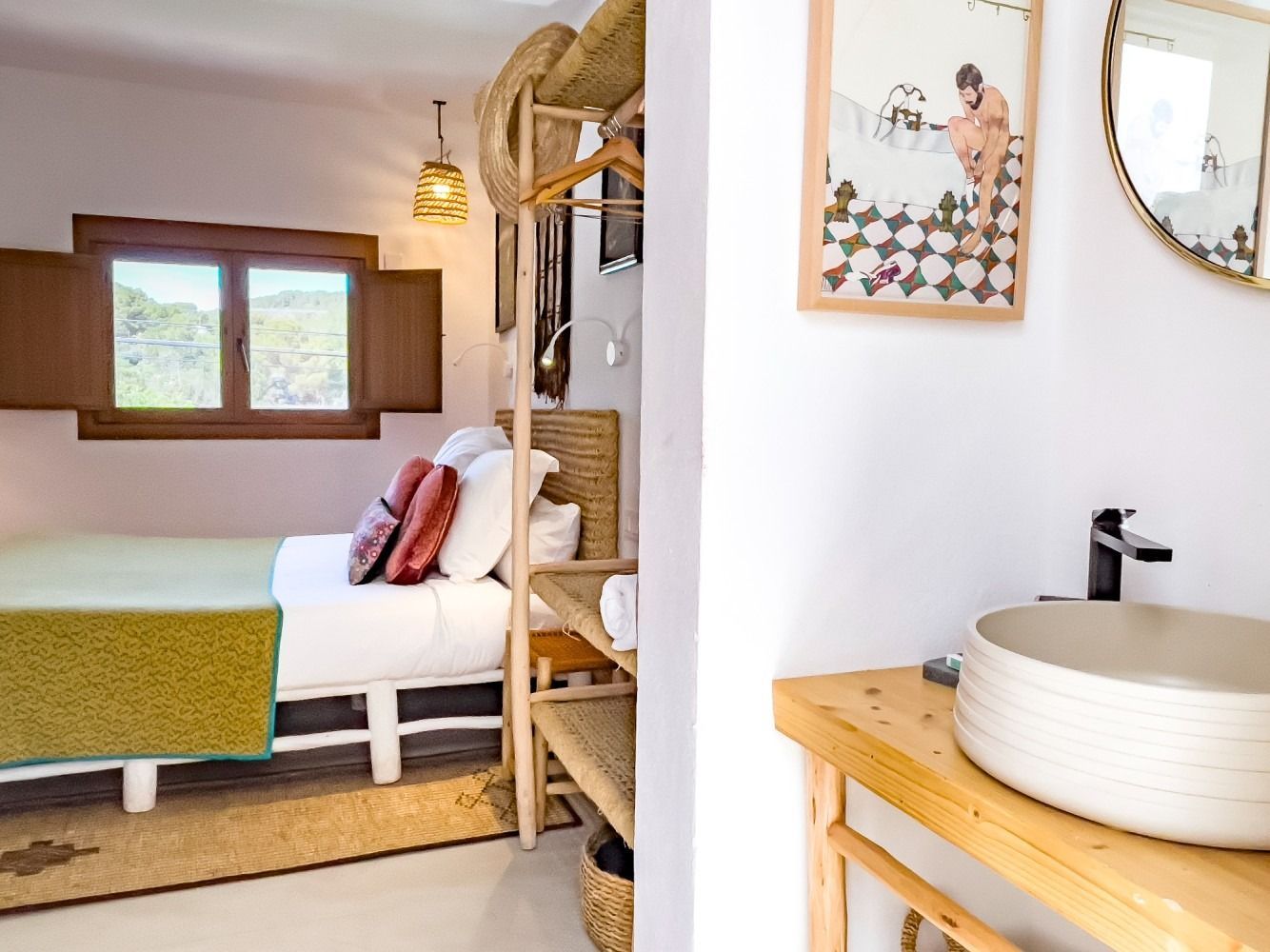 A bedroom with a bed and a sink in it