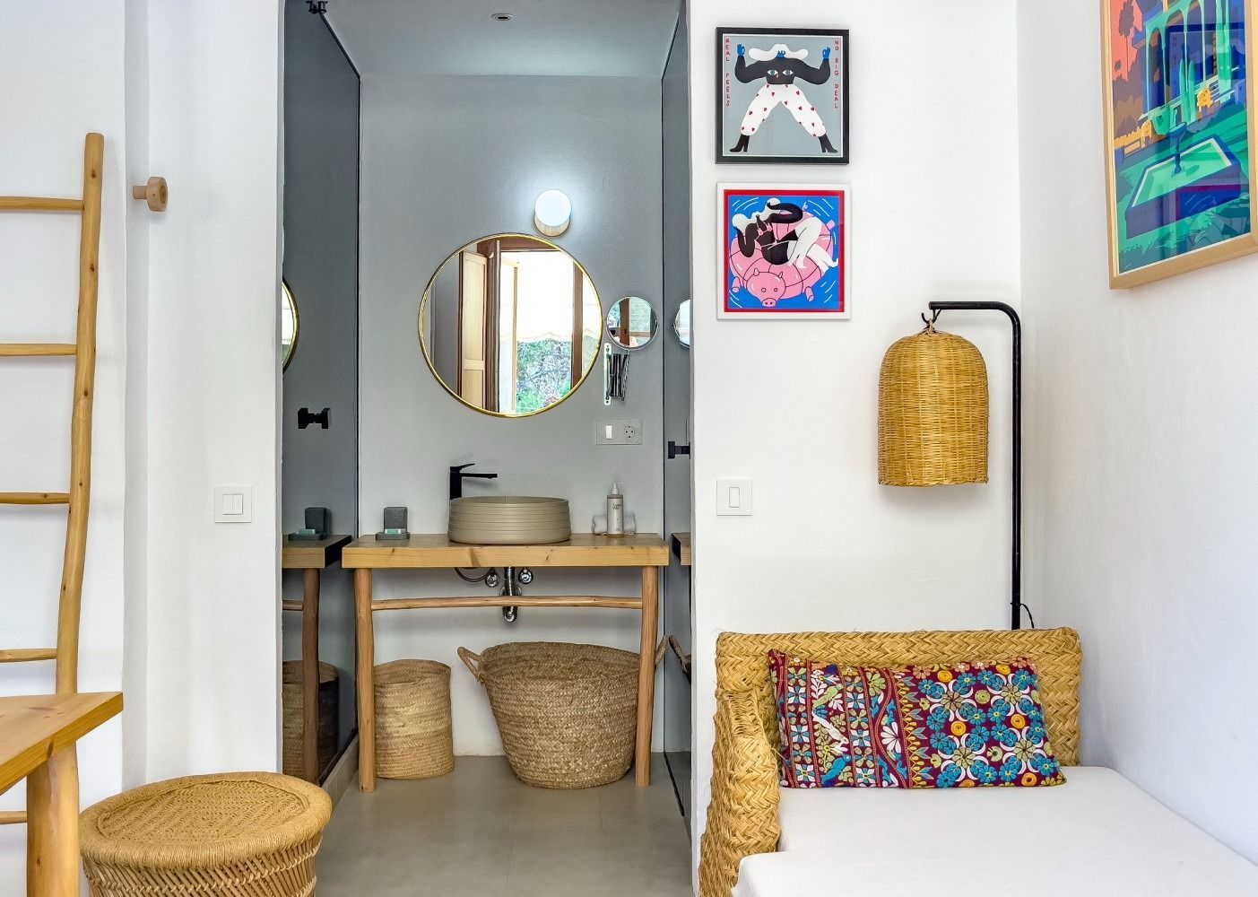 A bathroom with a sink and a couch in it