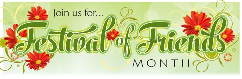 A light green banner with red flowers that says
