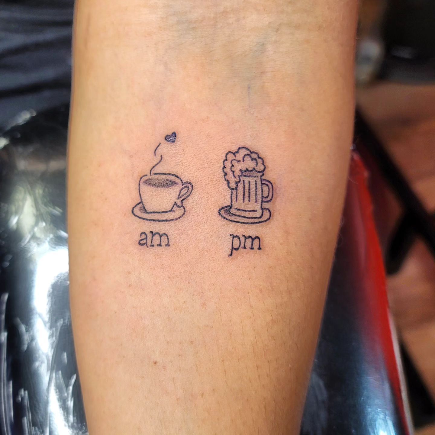 A woman has a small tattoo of a bird on her neck.
