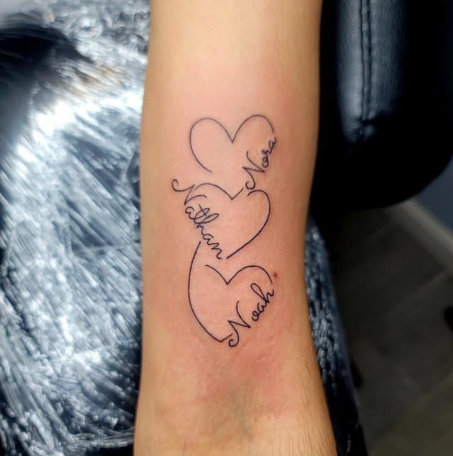 A woman with a tattoo on her arm covering her face.