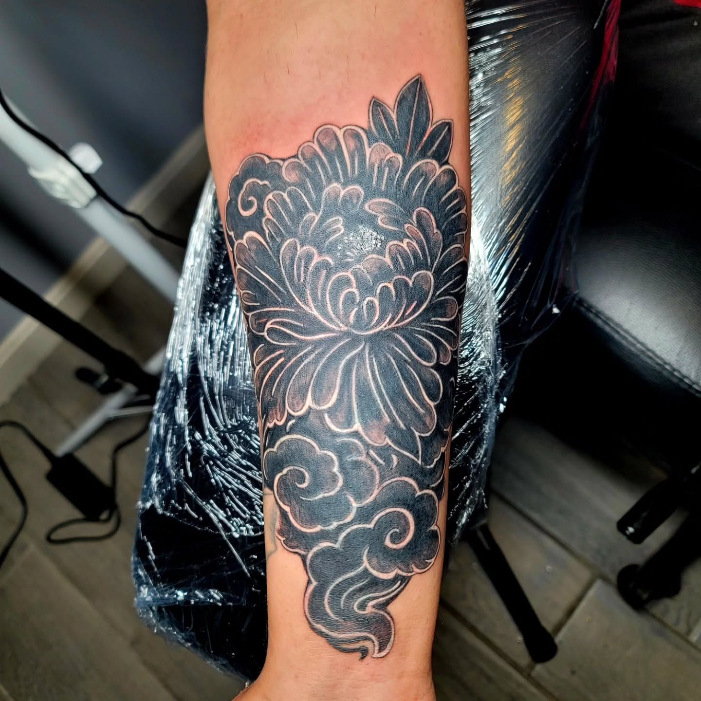 a man with tattoos on hand