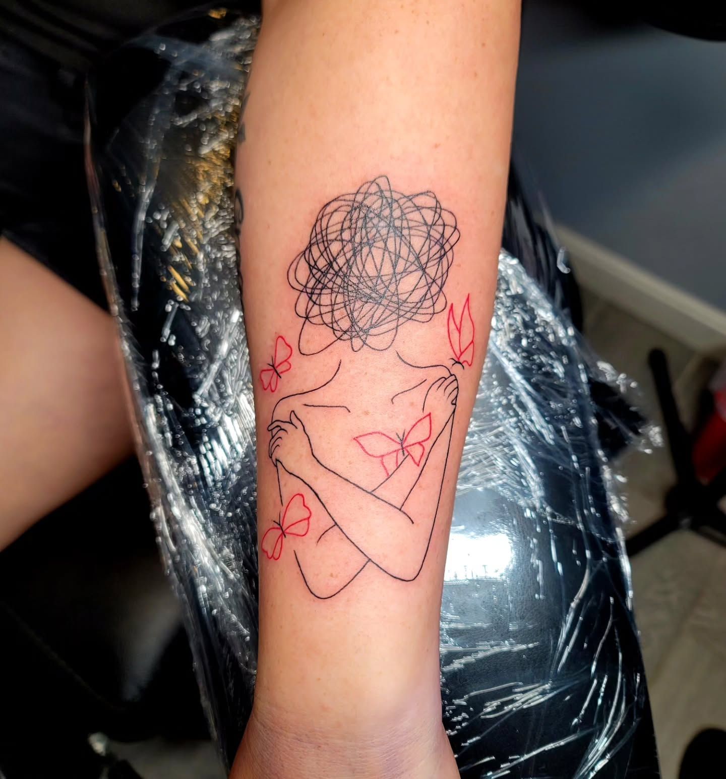 trying out a tattoo on a woman's hand