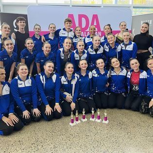 Dancer Wearing Blue Jacket — Dance Classes In Townsville