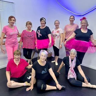 Mature Dancer Stretching — Dance Classes In Townsville