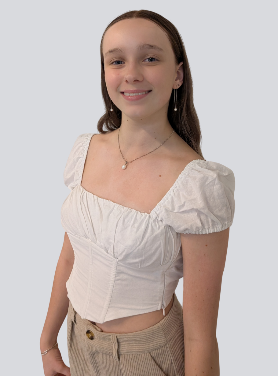 The girl is wearing a white t-shirt.