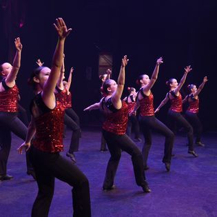 Women Dancing On Stage — Dance Classes In Townsville