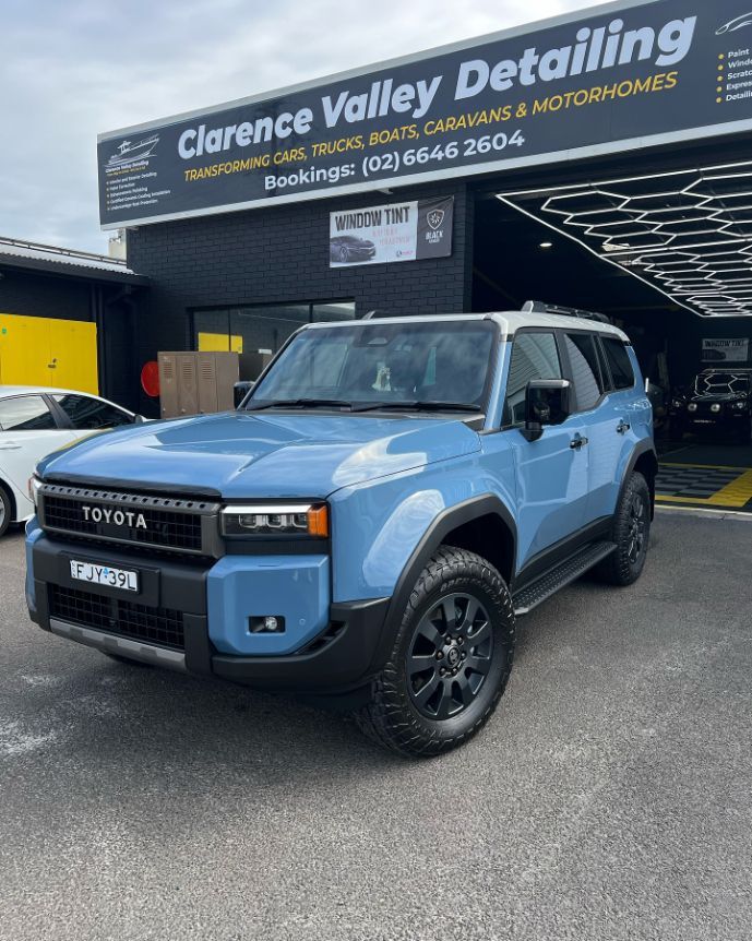 A Blue Toyota Fj Cruiser is Parked in Front of a Car Detailing Shop — Clarence Valley Detailing In Yamba, NSW