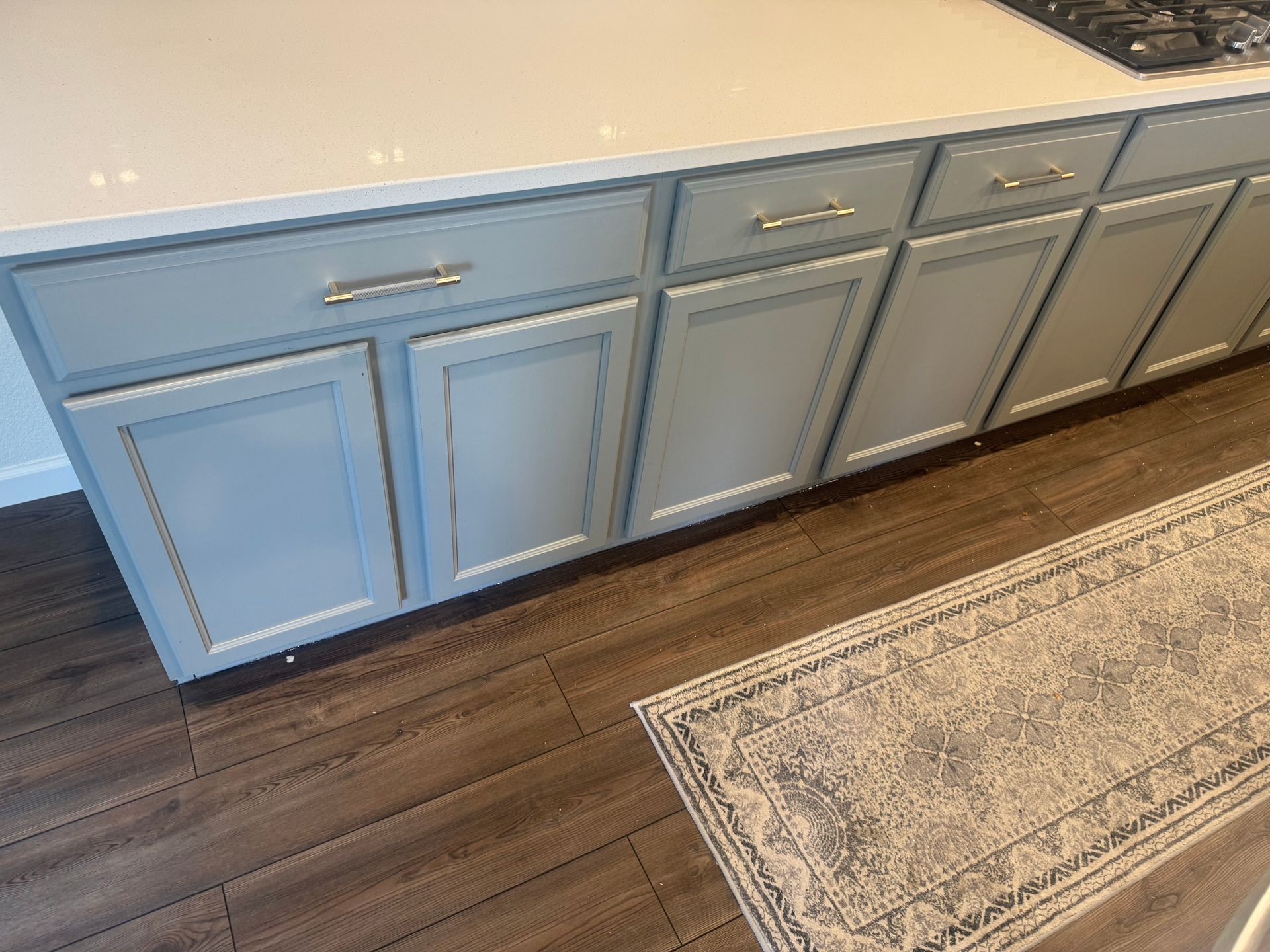 A kitchen under construction with a large island in the middle.