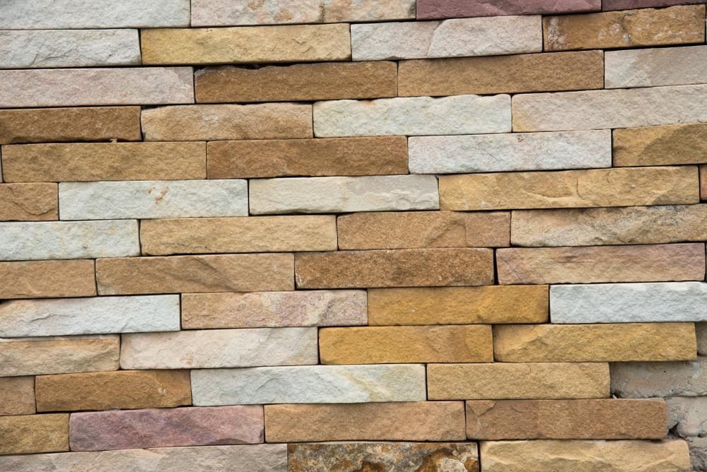 A Close Up Of A Brick Wall Made Of Different Colored Brick — Southern Bricks & Pavers In Ulladulla, NSW