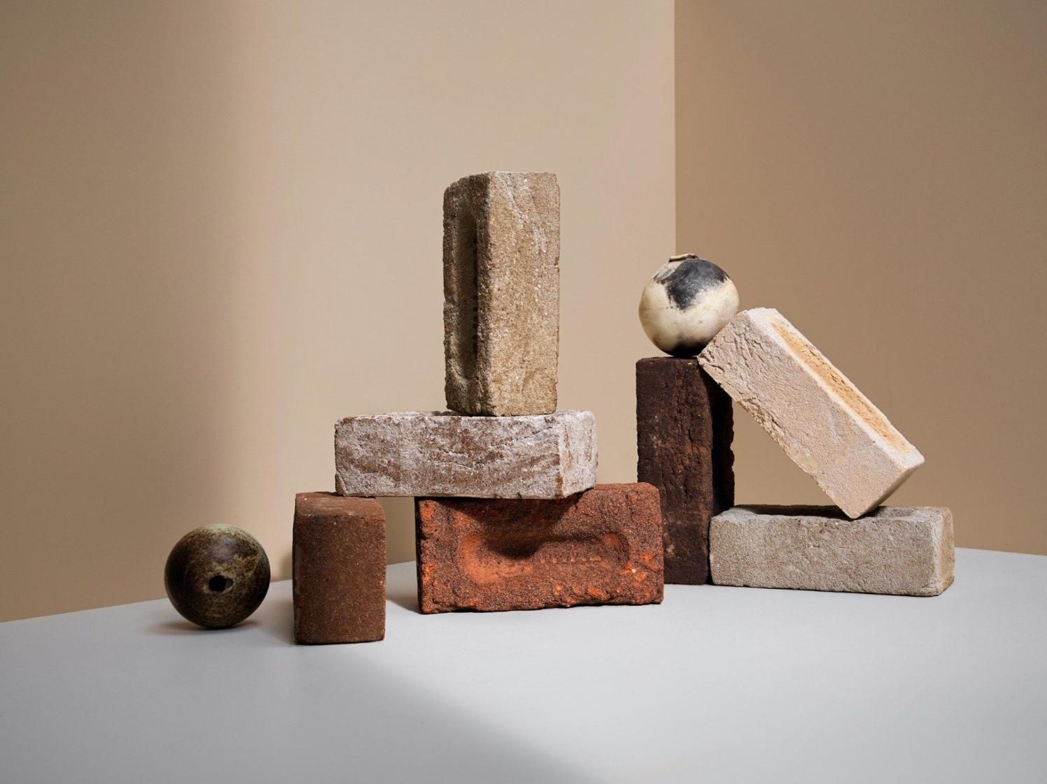A Group Of Bricks Stacked On Top Of Each Other On A Table — Southern Bricks & Pavers In Batemans Bay, NSW