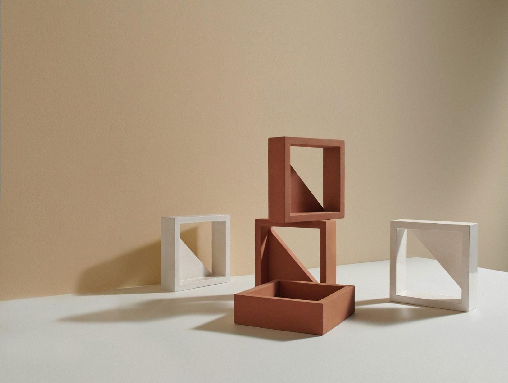A Group Of Squares Are Stacked On Top Of Each Other On A Table — Southern Bricks & Pavers In Ulladulla, NSW