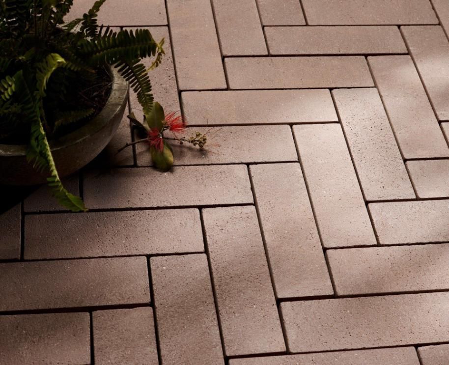 A Potted Plant Sits On A Brick Floor — Southern Bricks & Pavers In Ulladulla, NSW