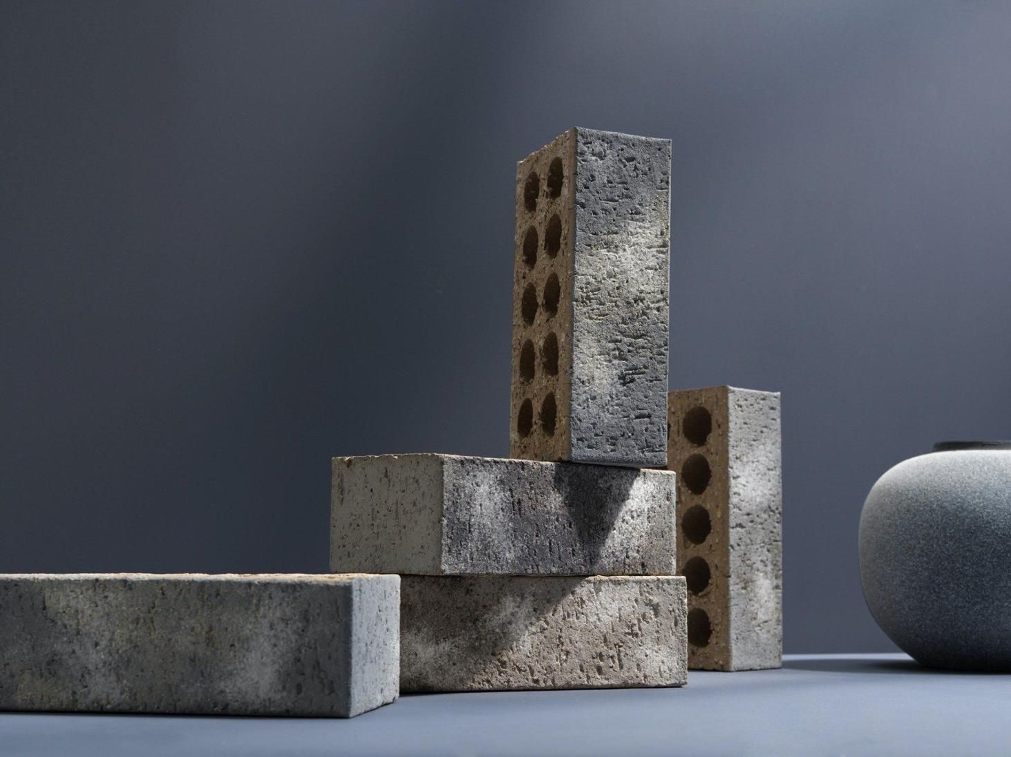 A Stack Of Bricks Sitting On Top Of Each Other On A Table — Southern Bricks & Pavers In Ulladulla, NSW
