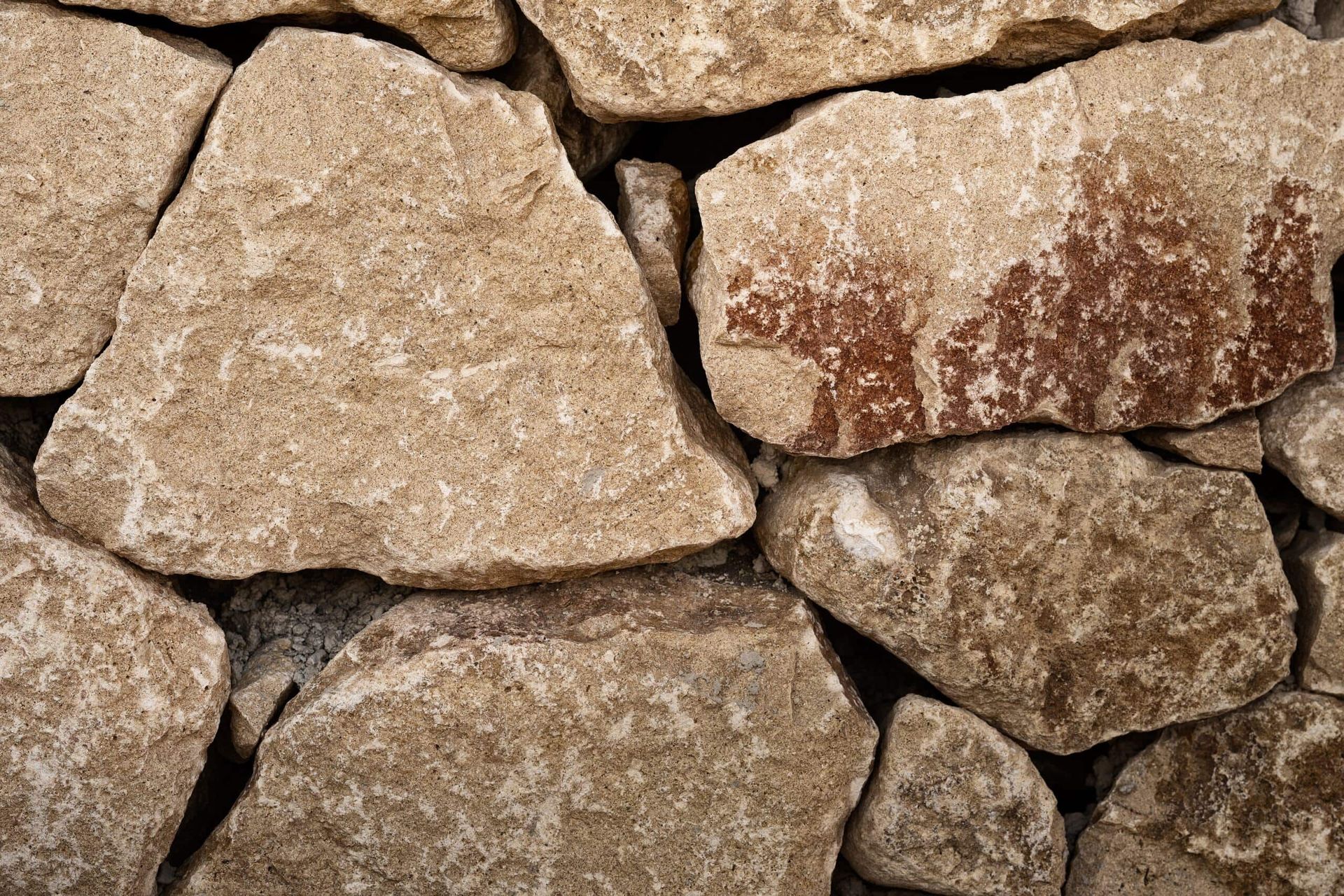 A Close Up of a Pile of Rocks Stacked on Top of Each Other — Southern Bricks & Pavers In Ulladulla, NSW