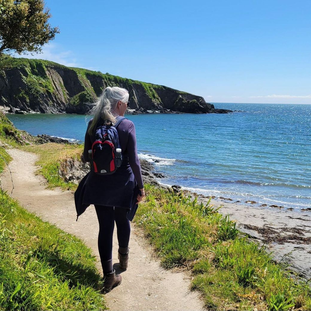 Lucy Daniel guide walking at Polridmouth Cove one the South West Coast Path