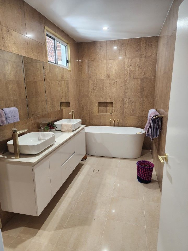 A Modern Bathroom With A White Double Vanity — Done Right Bathrooms And Renovations in Edmonton, QLD