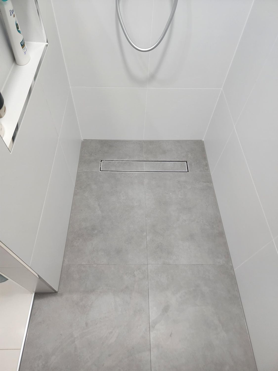 A Shower Stall With Gray Tiled Flooring — Done Right Bathrooms And Renovations in Edmonton, QLD