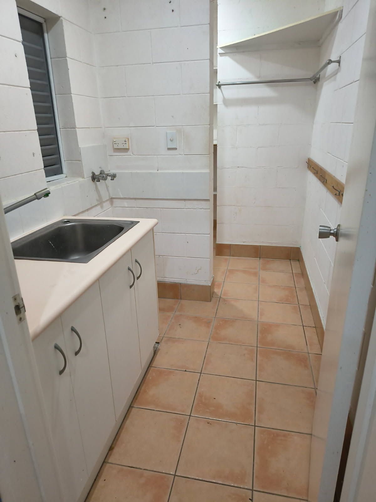 A Laundry Room Featuring White Block Walls — Done Right Bathrooms And Renovations in Edmonton, QLD