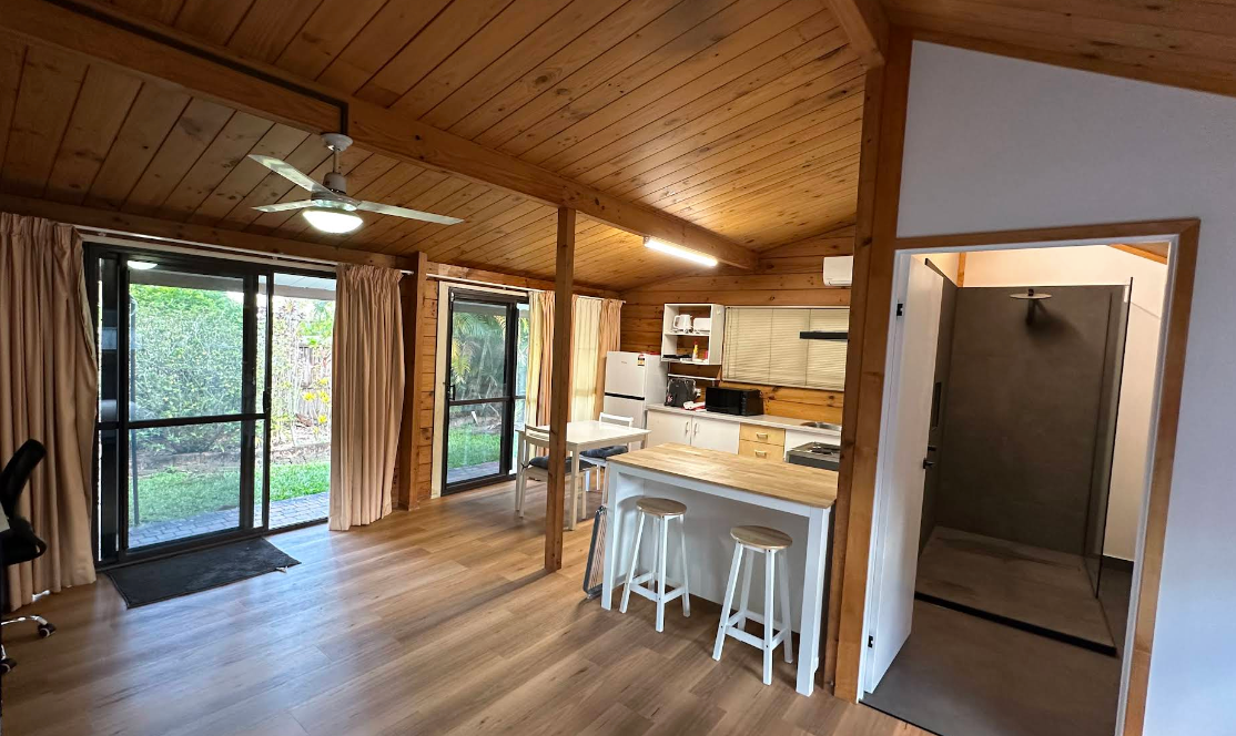 A Bright Kitchen Galley With White Cabinets — Done Right Bathrooms And Renovations in Edmonton, QLD
