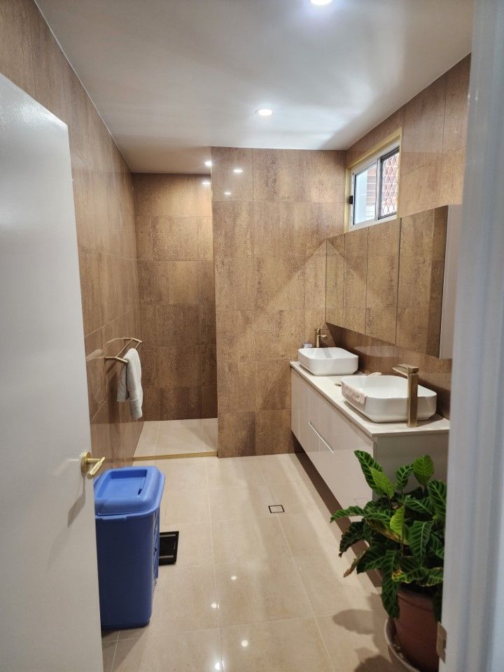 Small Restroom With Wood-paneled Walls — Done Right Bathrooms And Renovations in Edmonton, QLD
