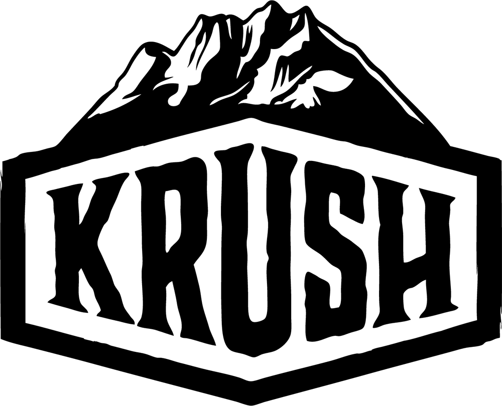 A black and white logo for krush with a mountain in the background.