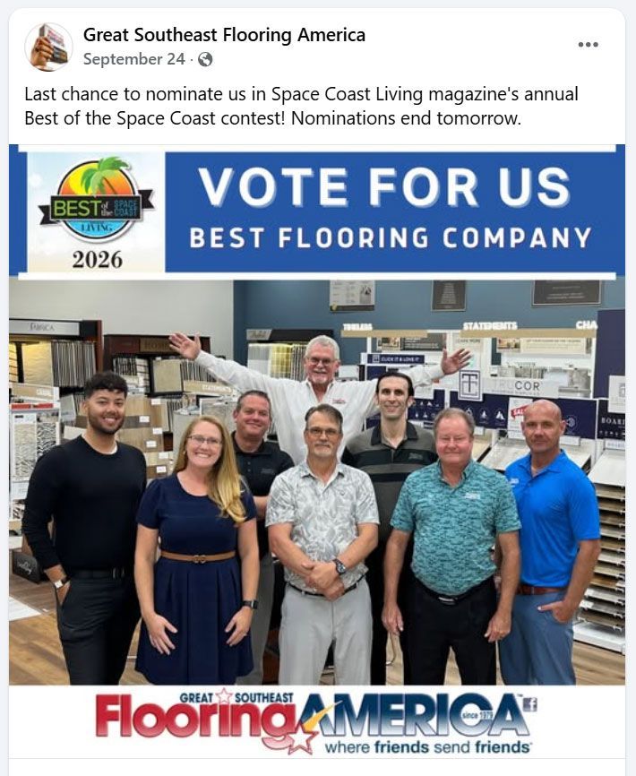 Team of flooring company employees posing with a 