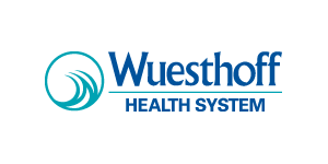 Logo for Wuesthoff Health System: a blue circle with wave design, text 