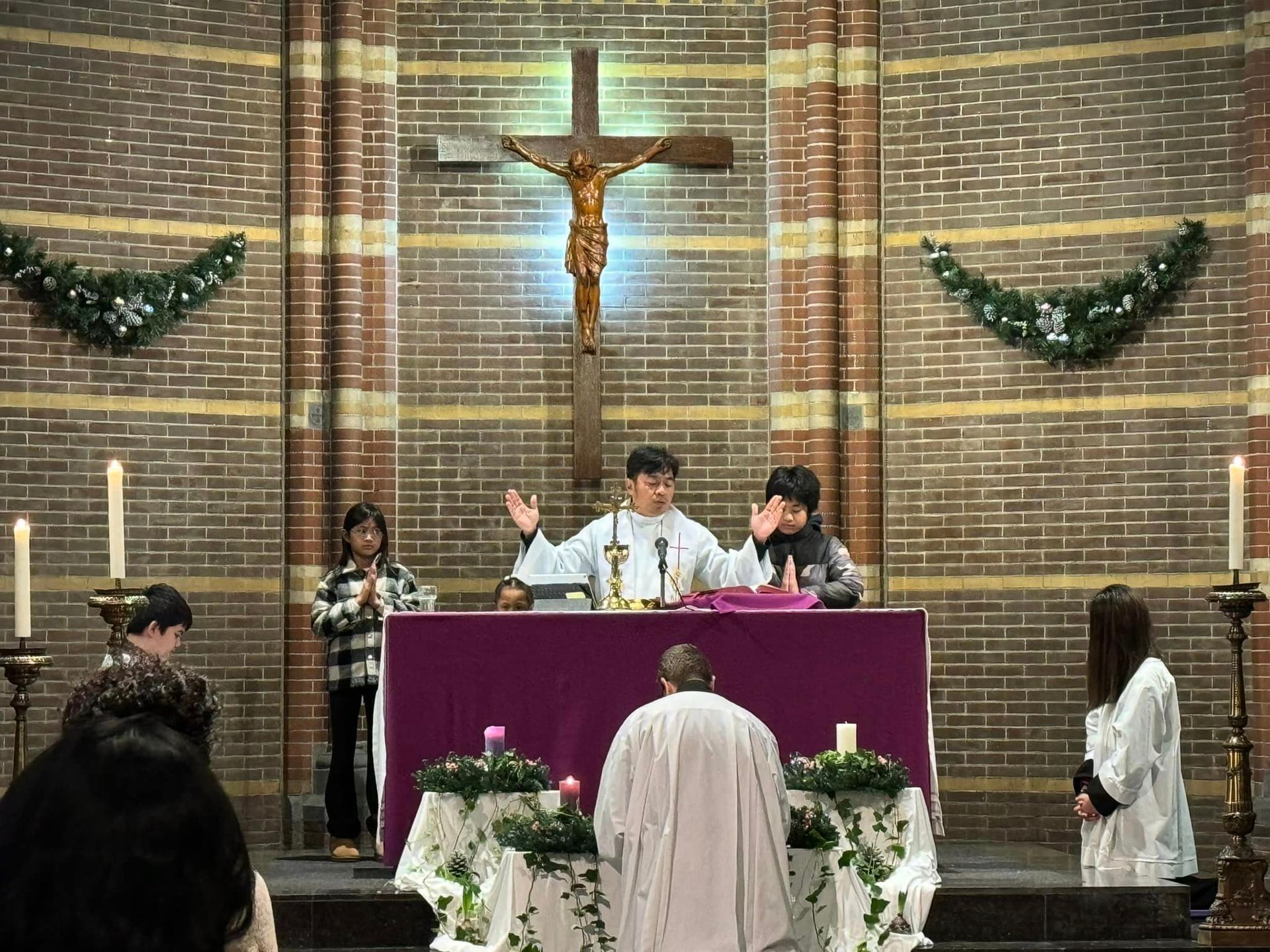 A group of people are standing around an altar in a church.