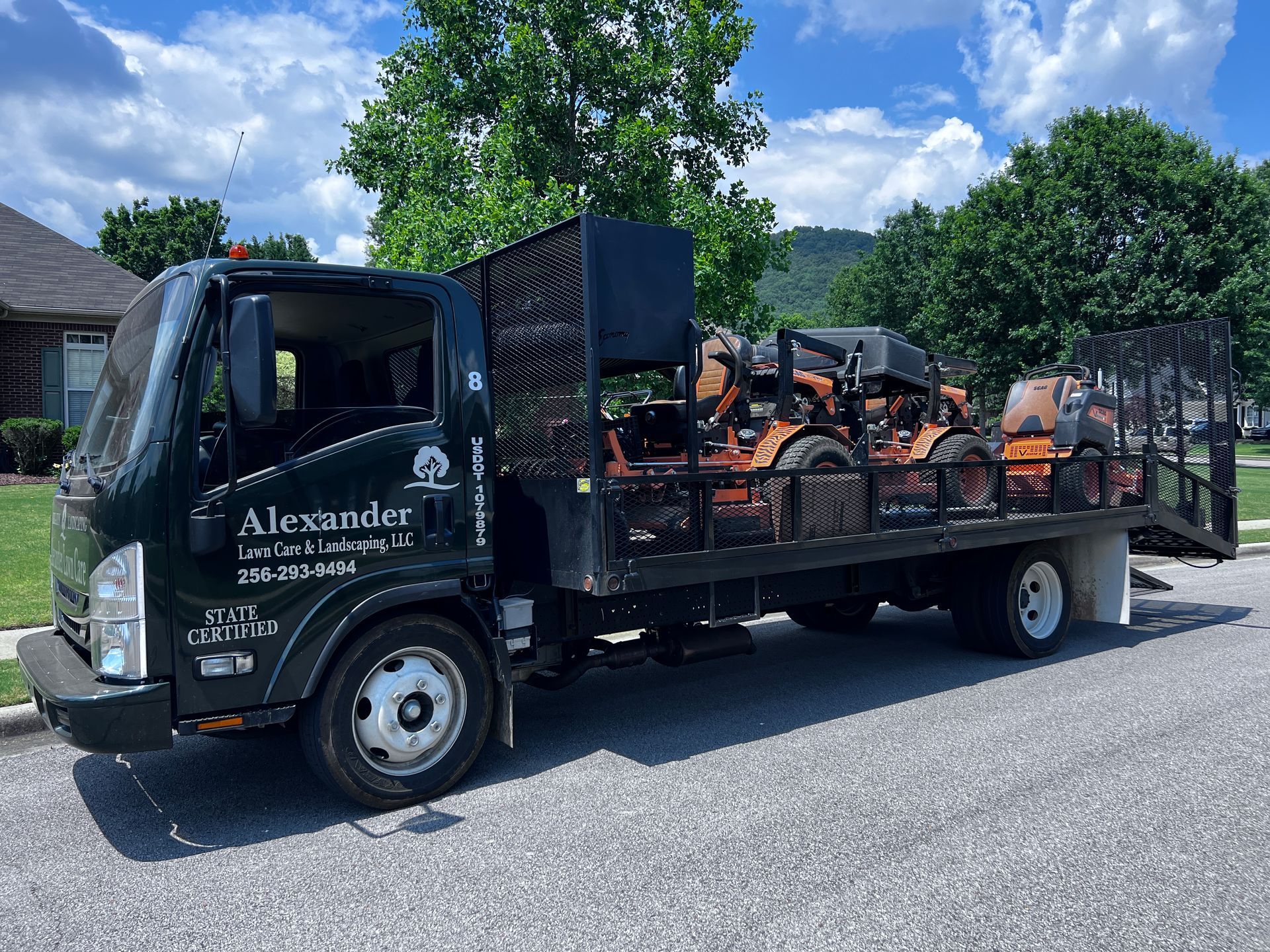 A tow truck is parked on the side of the road.